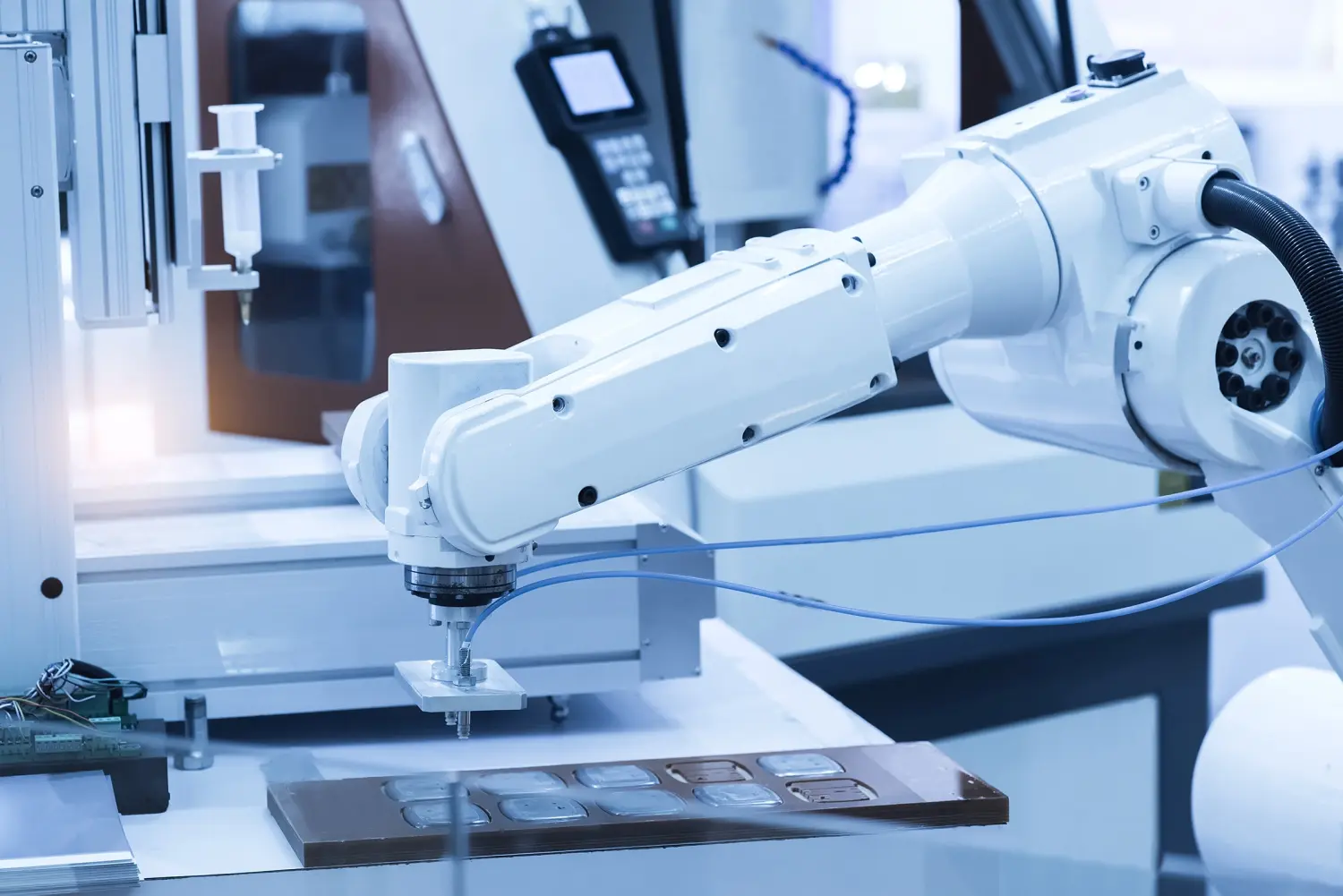 Robotic arm at production line in factory