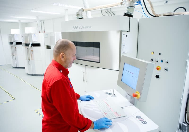 Man working with a 3D printer