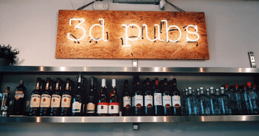 The 3D Pubs sign above our office alcohol selection at our in-house bar